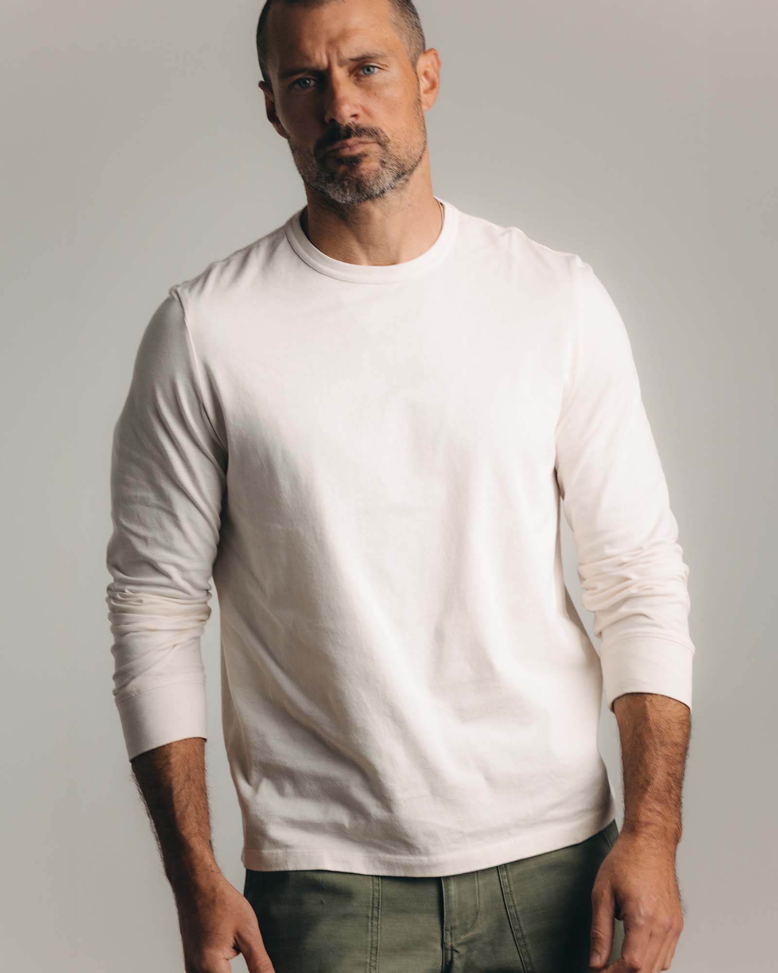 editorial flatlay of The Organic Cotton Long Sleeve Tee in Vintage White, Knits by Taylor Stitch