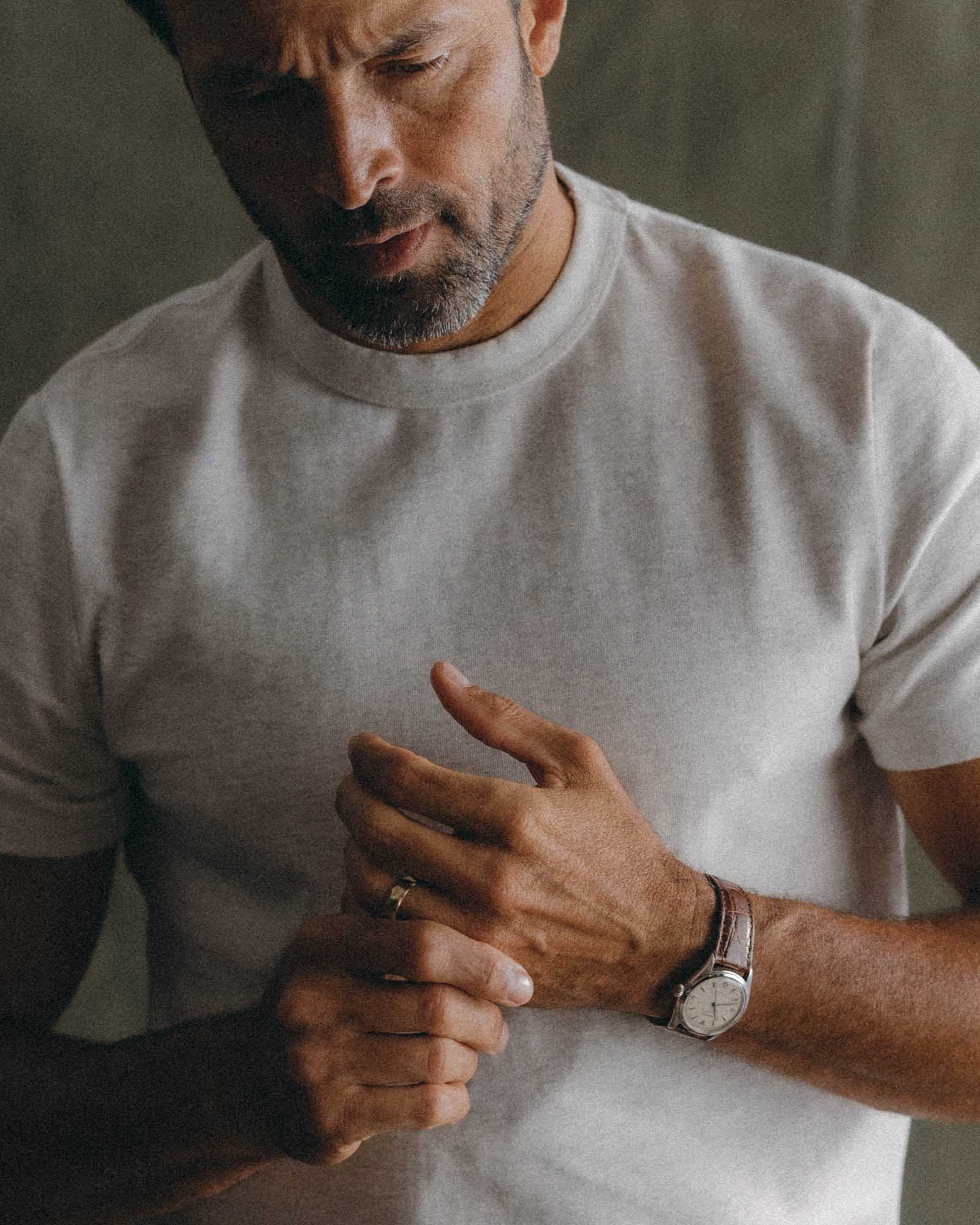 fit model tying a rope wearing The Organic Cotton Shop Tee in Oat Twist, Knits by Taylor Stitch