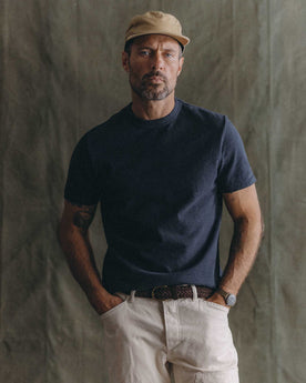 fit model sitting wearing The Organic Cotton Shop Tee in Navy Twist, Knits by Taylor Stitch