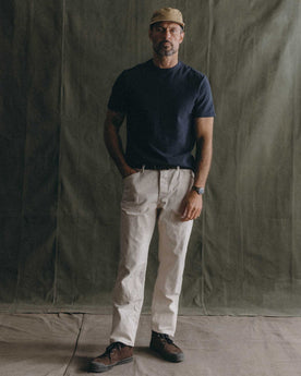 fit model holding a canoe wearing The Organic Cotton Shop Tee in Navy Twist, Knits by Taylor Stitch
