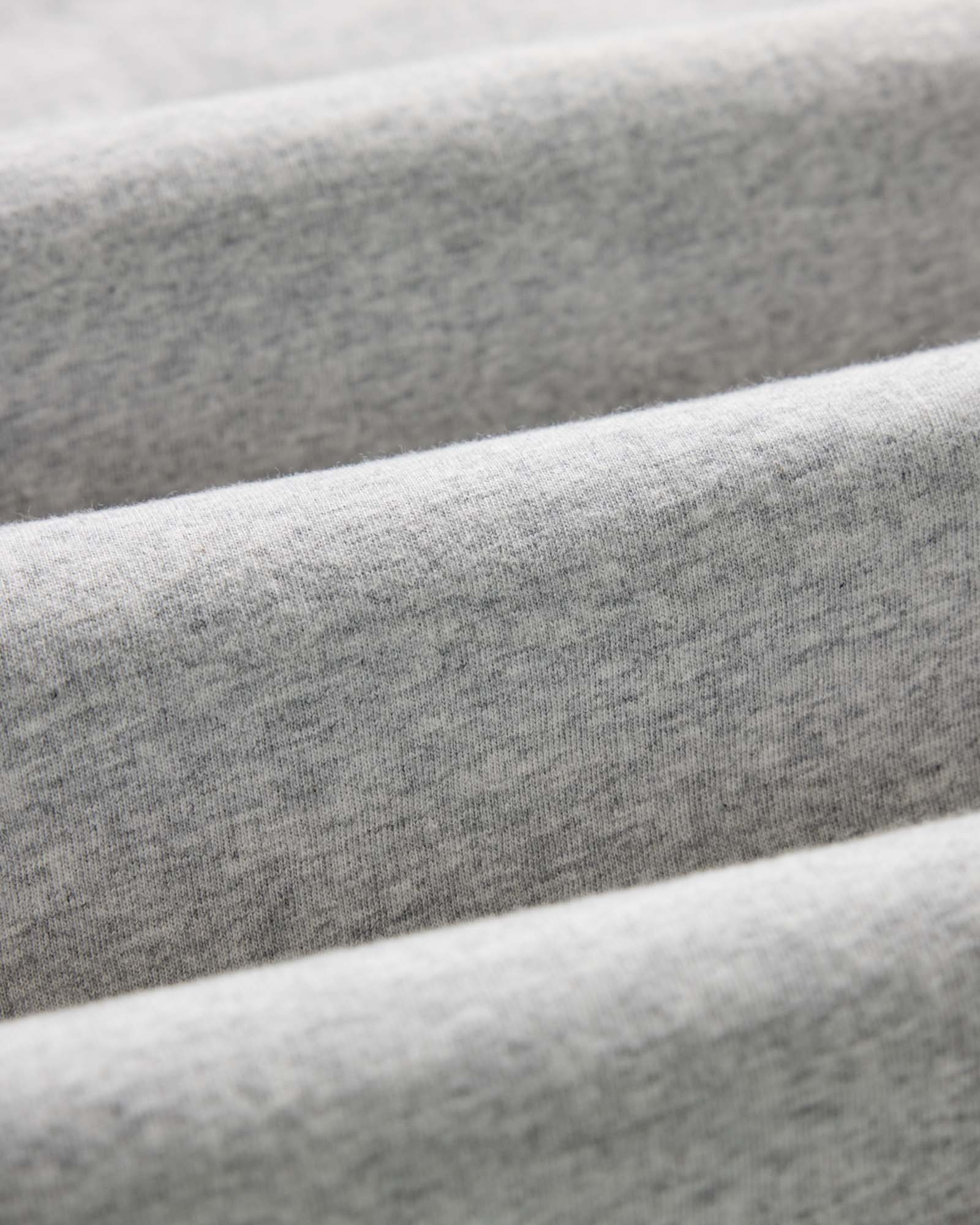 material shot of the fabric on The Organic Cotton Tee in Heather Grey, Knits by Taylor Stitch
