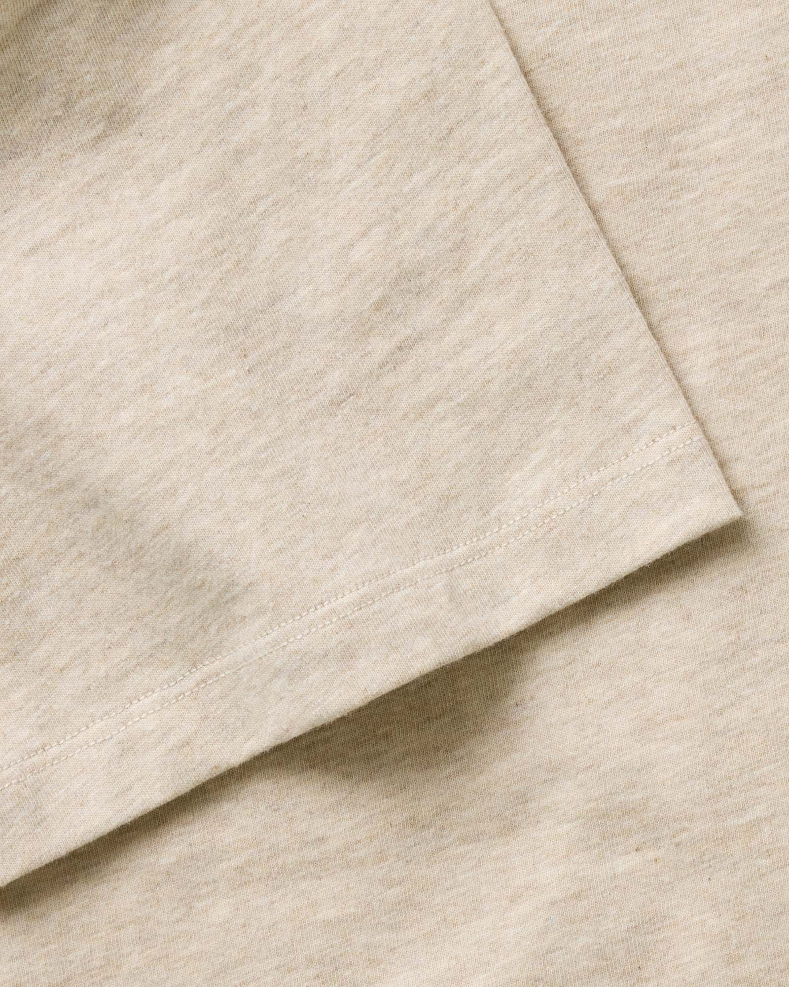material shot of the sleeve on The Organic Cotton Tee in Heather Oat, Knits by Taylor Stitch