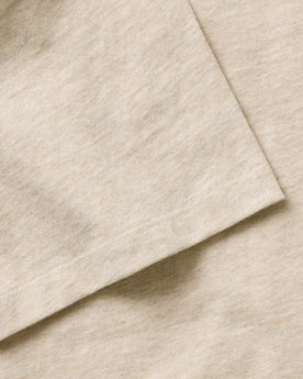 material shot of the sleeve on The Organic Cotton Tee in Heather Oat, Knits by Taylor Stitch