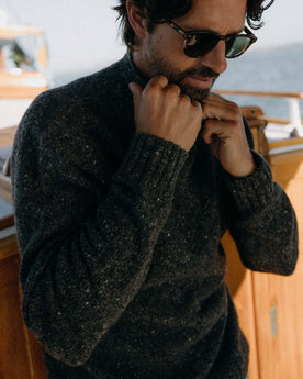 fit model posing in The Seafarer Sweater in Charcoal Donegal, Knits by Taylor Stitch