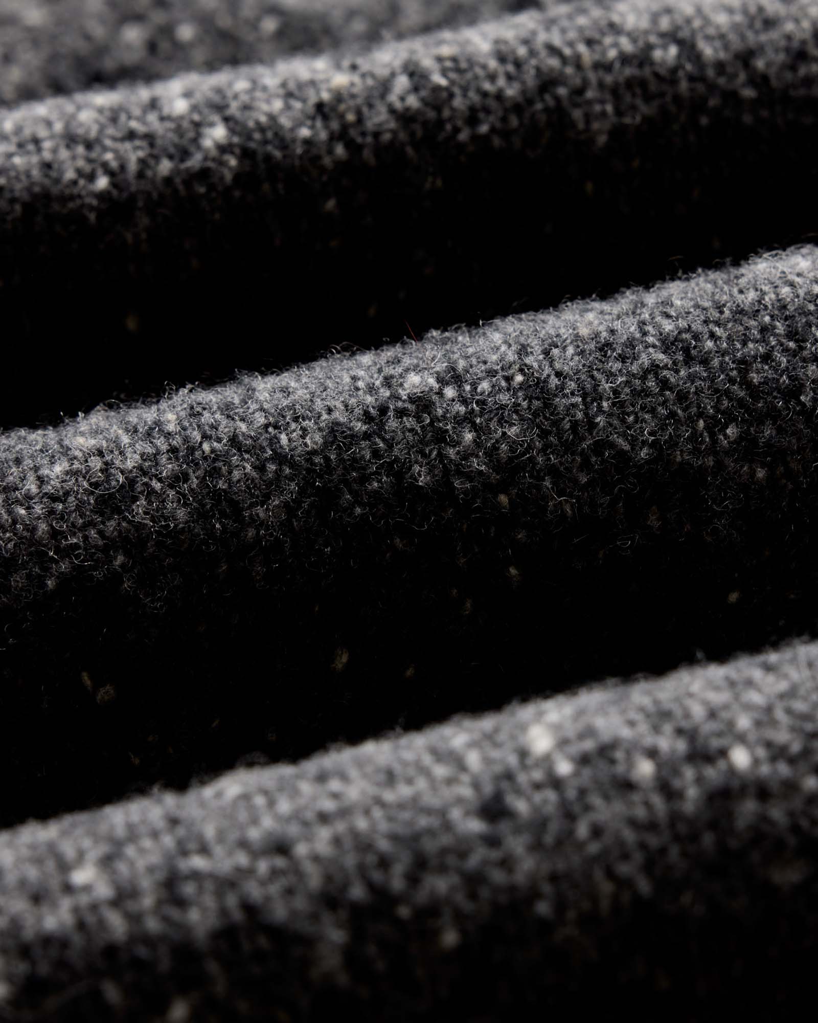 material shot of the fabric on The Seafarer Sweater in Charcoal Donegal, Knits by Taylor Stitch