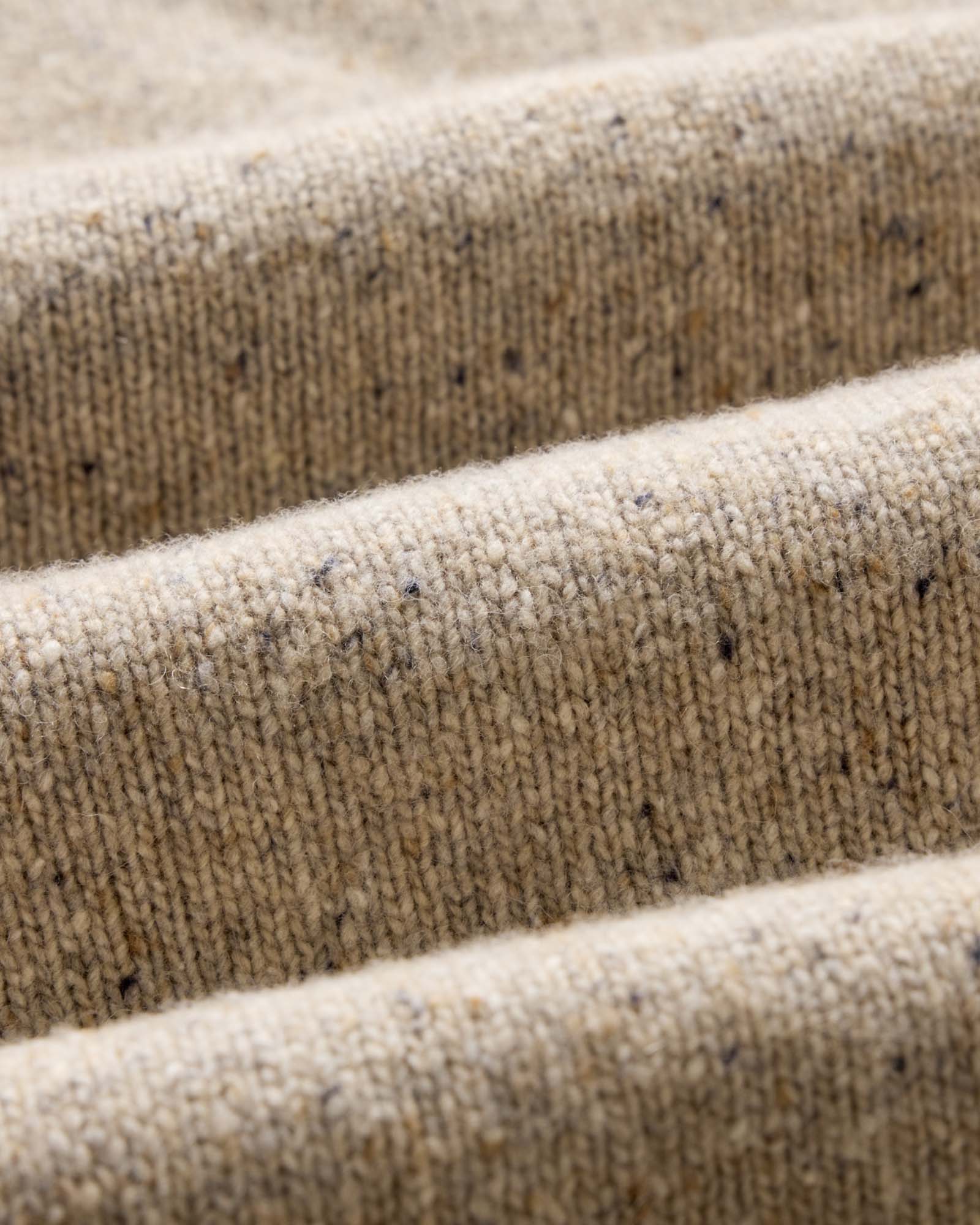 material shot of the fabric on The Seafarer Sweater in Natural Donegal, Knits by Taylor Stitch