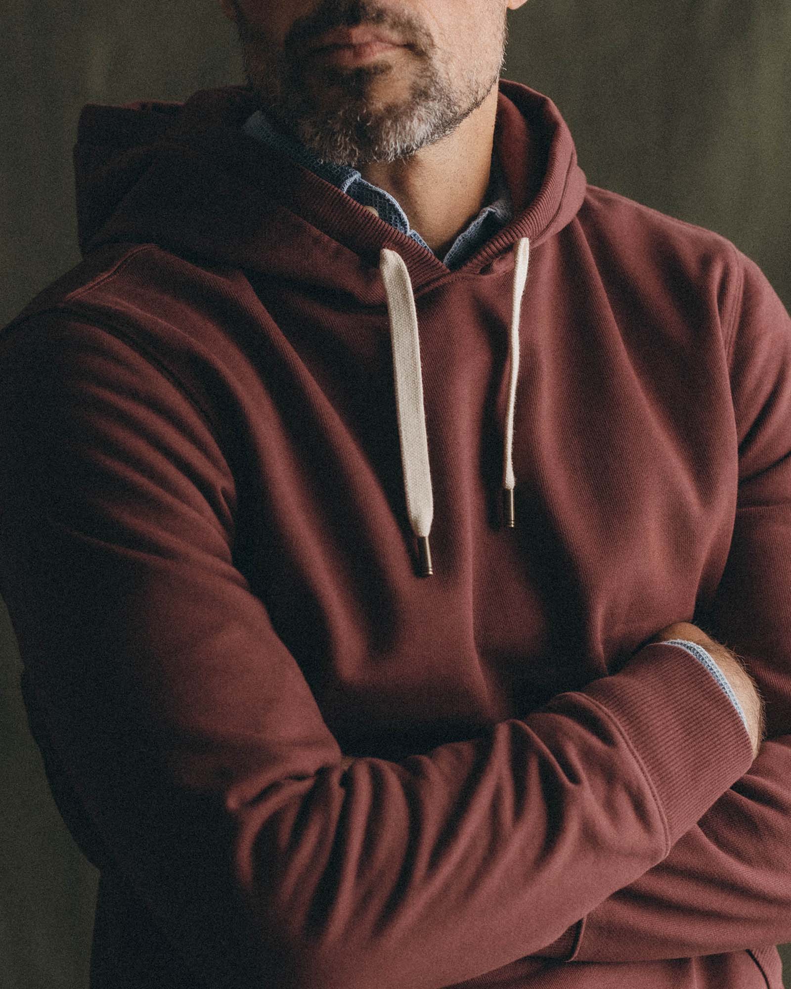 fit model showing off The Shop Hoodie in Dried Cherry, Knits by Taylor Stitch
