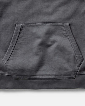 material shot of the pocket on The Shop Hoodie in Faded Black, Knits by Taylor Stitch
