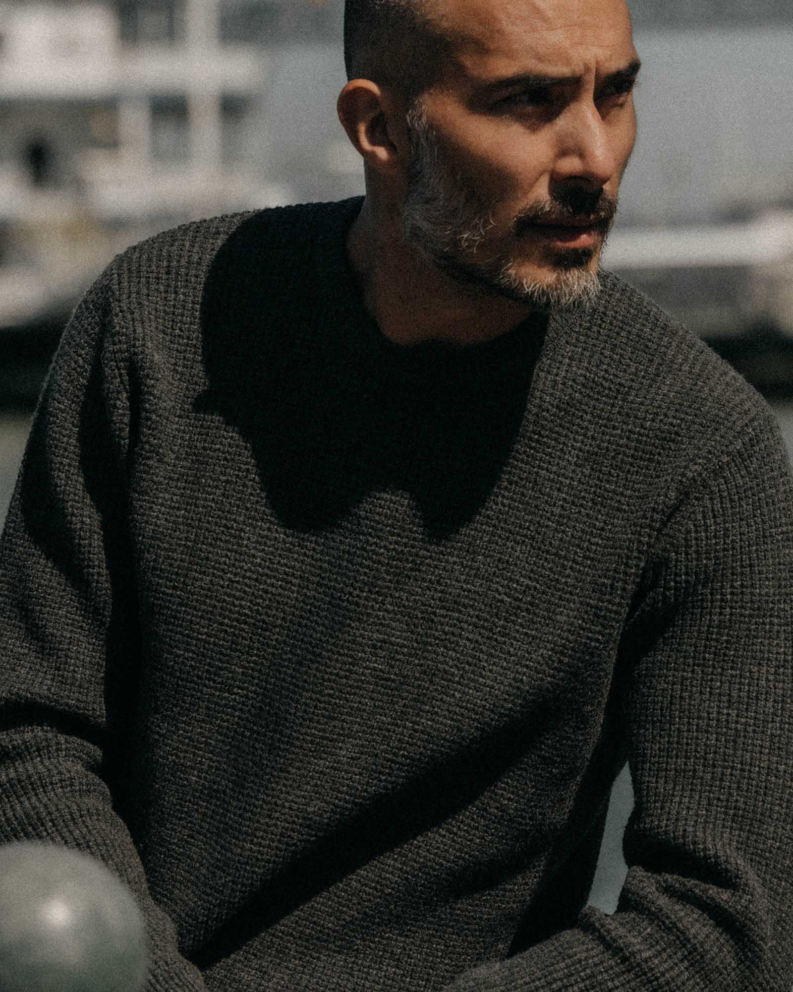 fit model posing in The Sidecountry Crew in Heather Graphite Merino Waffle, Knits by Taylor Stitch