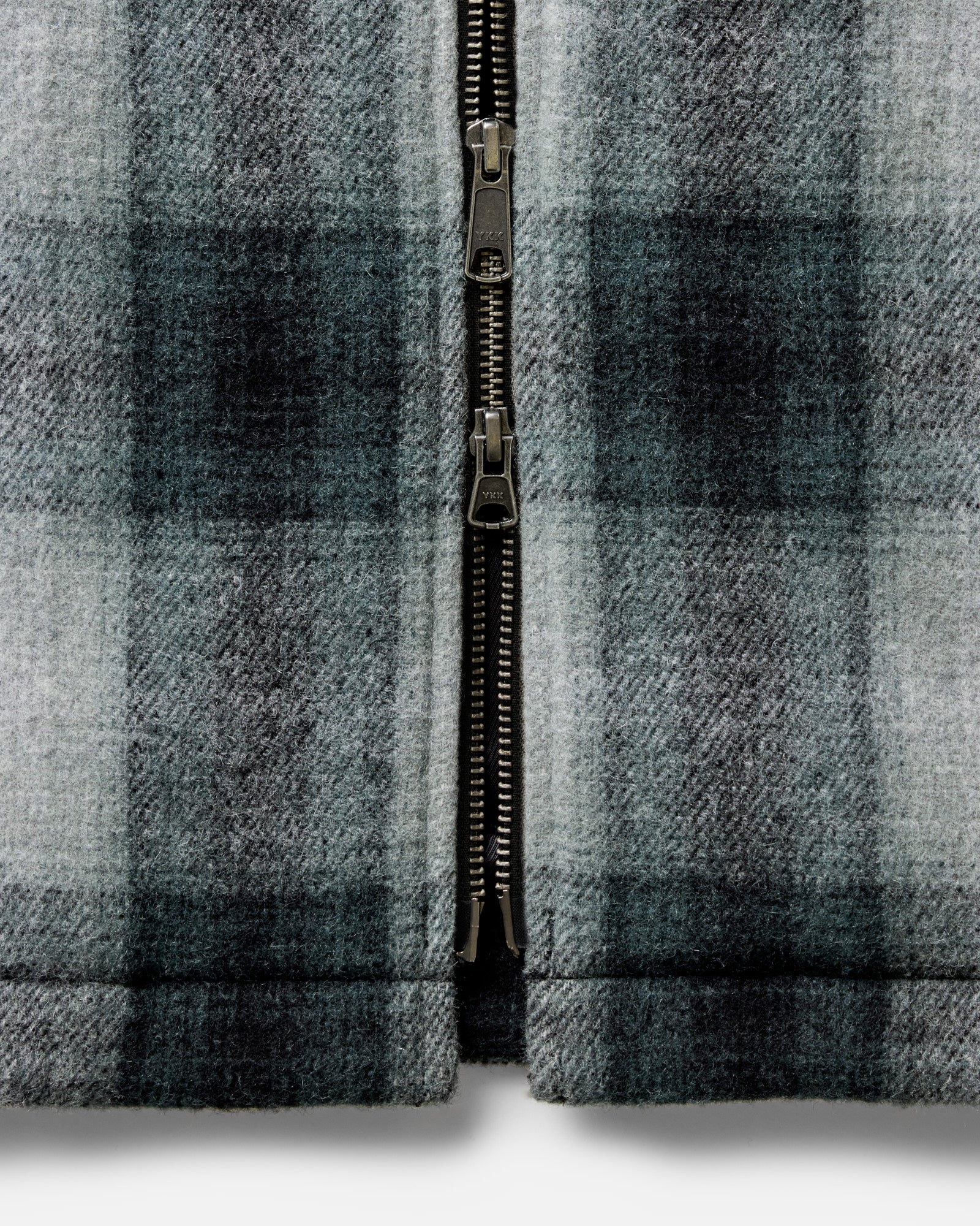 material shot of the zipper on The Waterfront Jacket in Evergreen Plaid Wool, Outerwear by Taylor Stitch