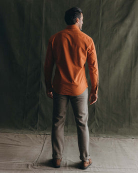 fit model showing off the back of The Yosemite Shirt in Summit Orange, Wovens by Taylor Stitch