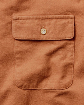 material shot of the pocket on The Yosemite Shirt in Summit Orange, Wovens by Taylor Stitch