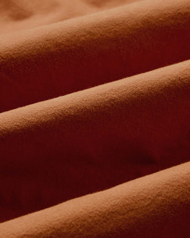 material shot of the fabric on The Yosemite Shirt in Summit Orange, Wovens by Taylor Stitch