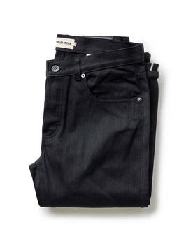 folded flatlay of The Democratic Jean in Rigid Black Organic Selvedge, Bottoms by Taylor Stitch