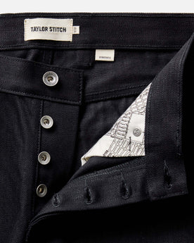 flatlay of The Democratic Jean in Rigid Black Organic Selvedge, Bottoms by Taylor Stitch