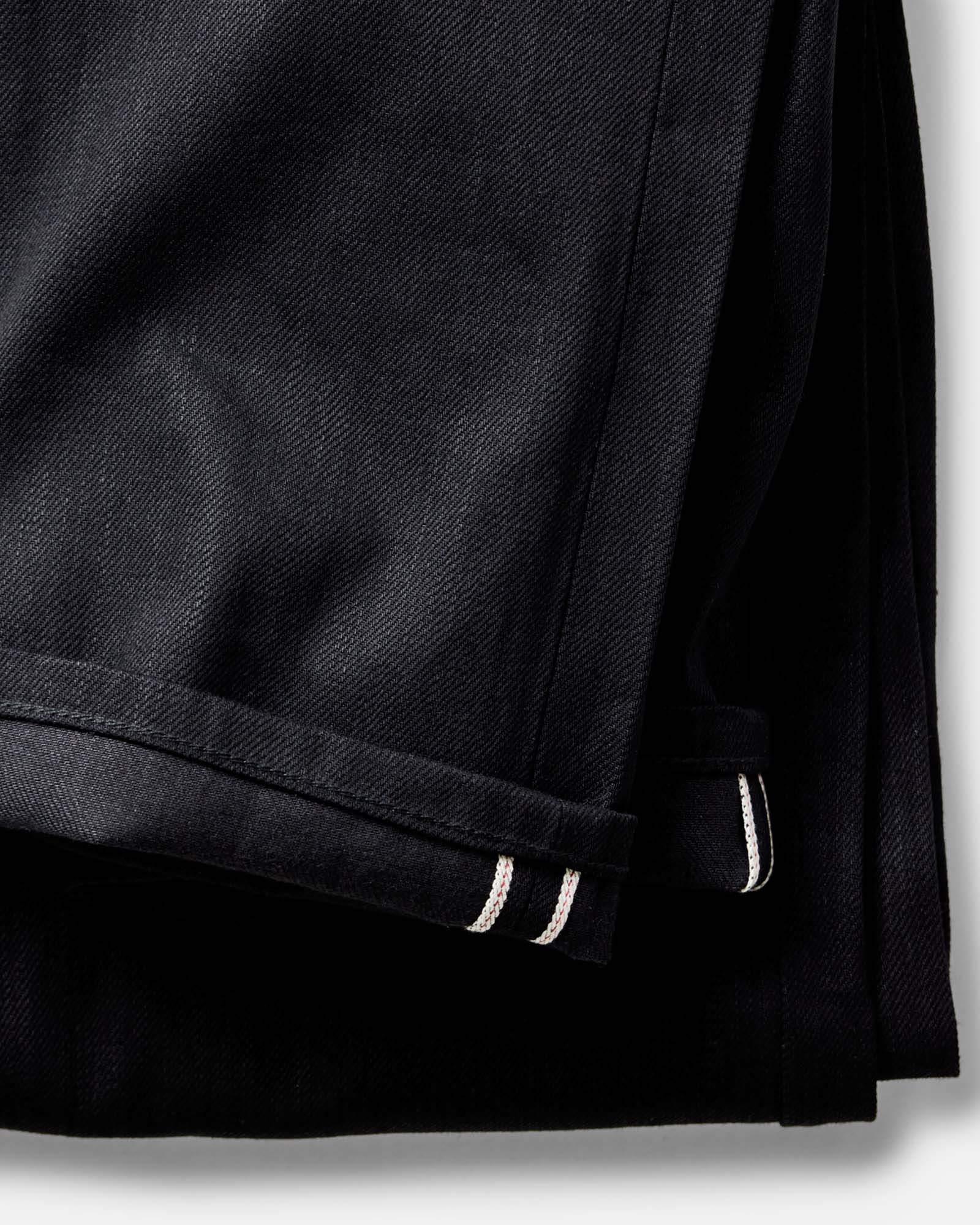 material shot of the button fly on The Democratic Jean in Rigid Black Organic Selvedge, Bottoms by Taylor Stitch