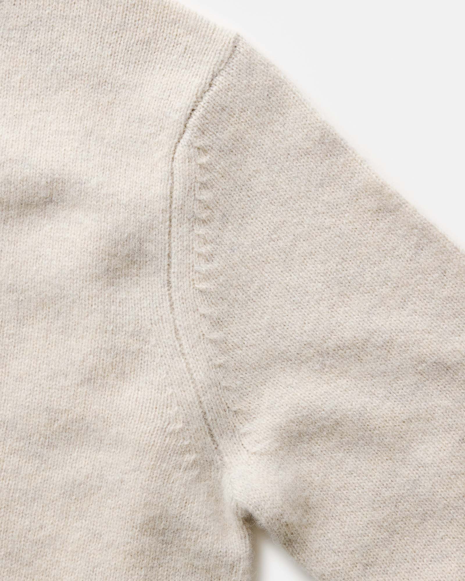 material shot of the shoulder on The Eastmoor Sweater in Heather Ivory Wool, Knits by Taylor Stitch