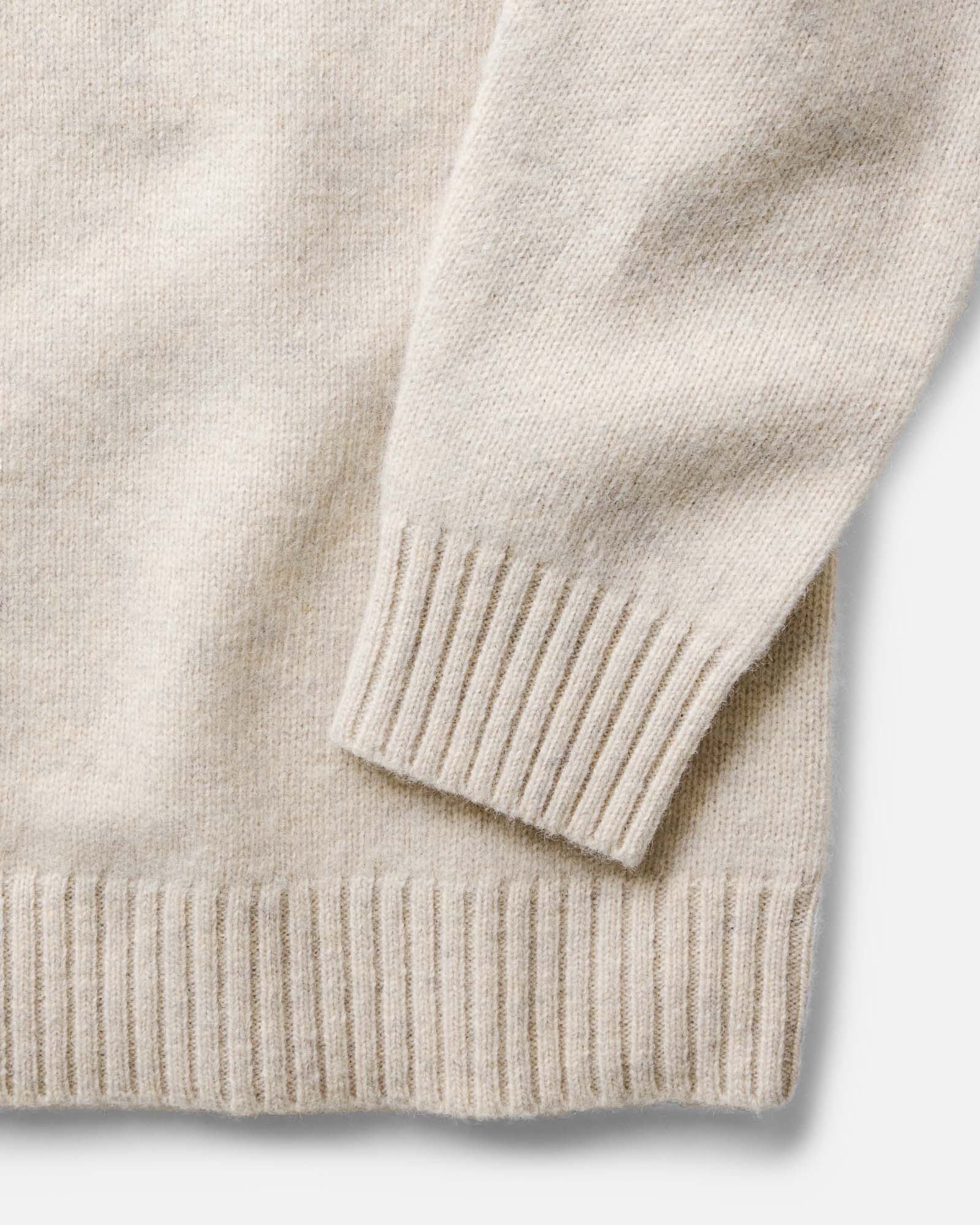 material shot of the sleeve on The Eastmoor Sweater in Heather Ivory Wool, Knits by Taylor Stitch