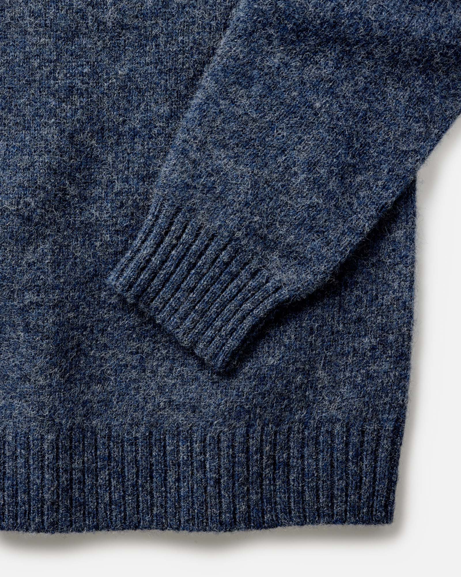 material shot of the sleeves on The Eastmoor Sweater in Heather Night Wool, Knits by Taylor Stitch