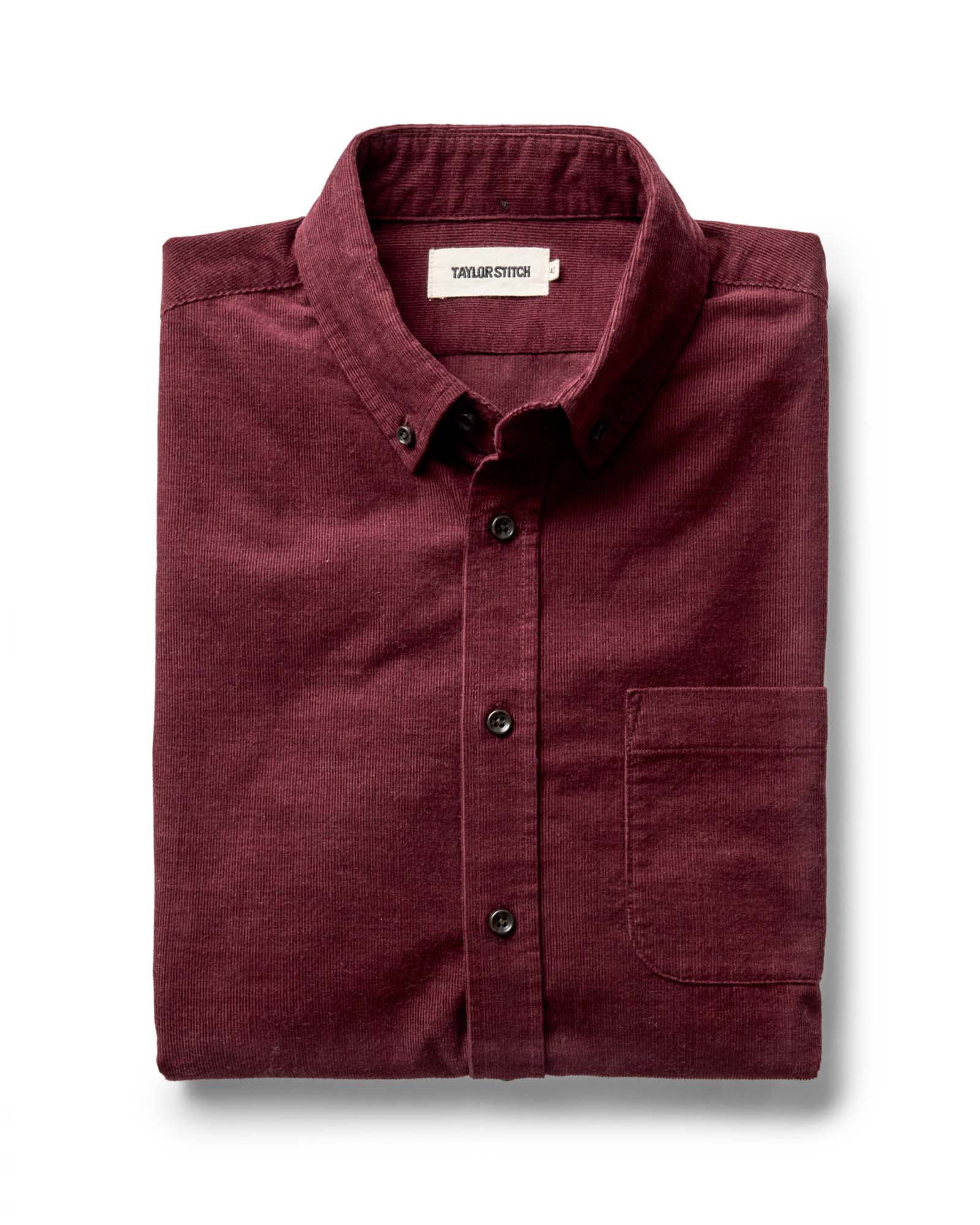folded flatlay of The Jack in Heather Burgundy Pincord, Wovens by Taylor Stitch