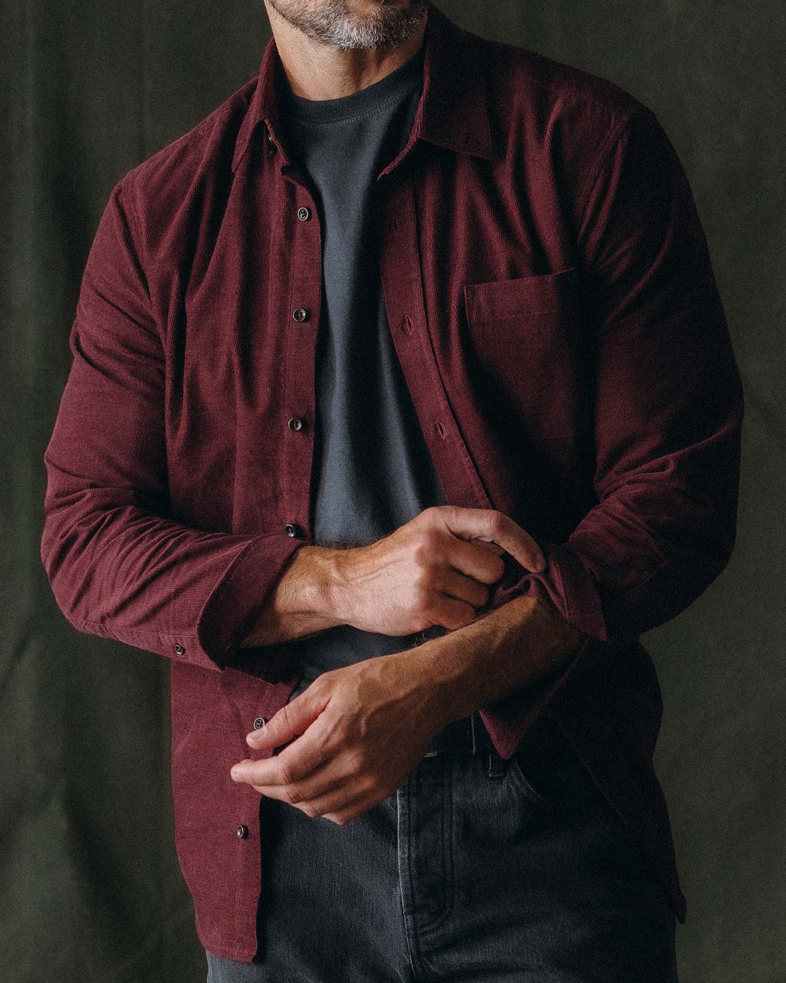 fit model adjusting the cuffs on The Jack in Heather Burgundy Pincord, Wovens by Taylor Stitch