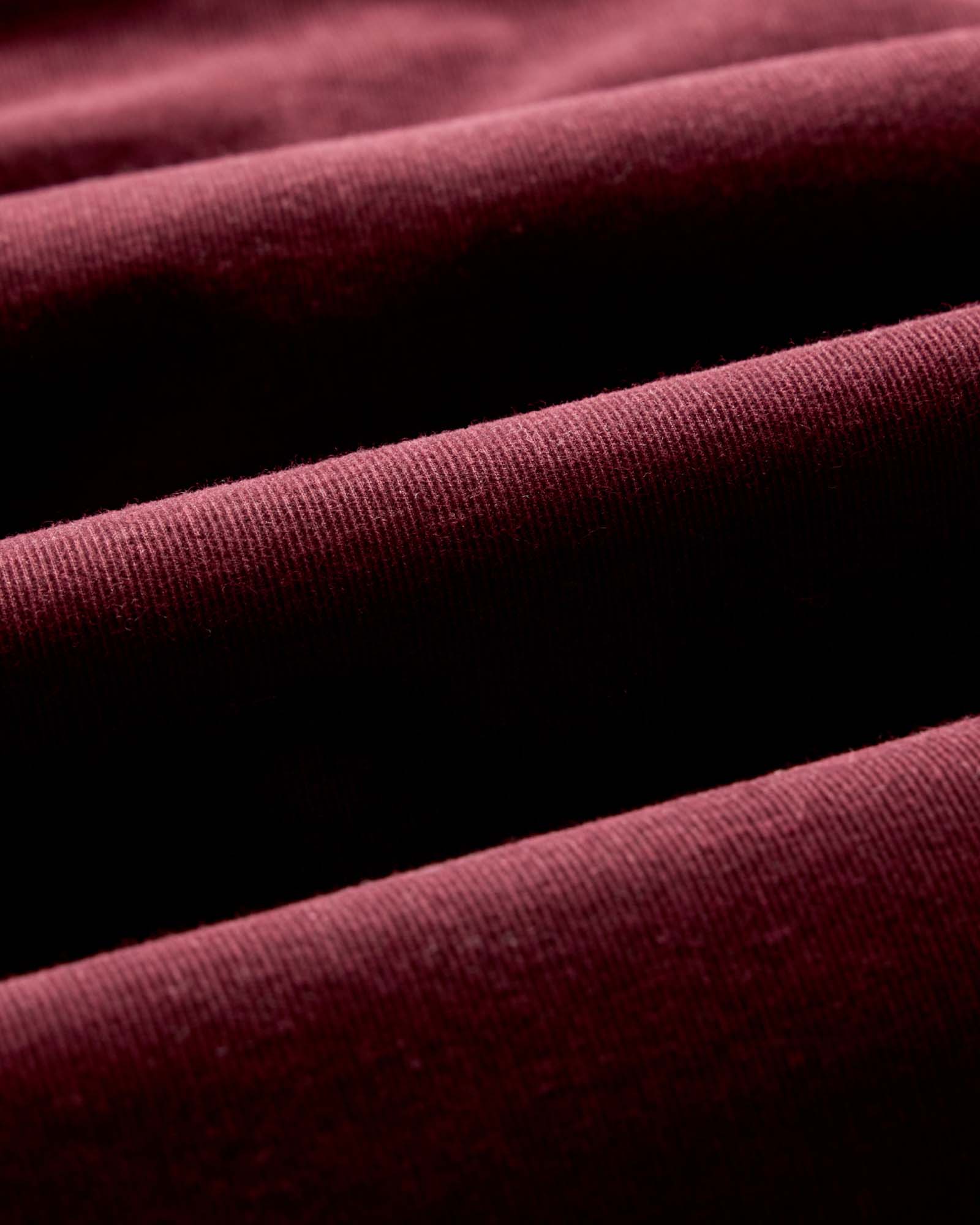 material shot of the fabric on The Jack in Heather Burgundy Pincord, Wovens by Taylor Stitch