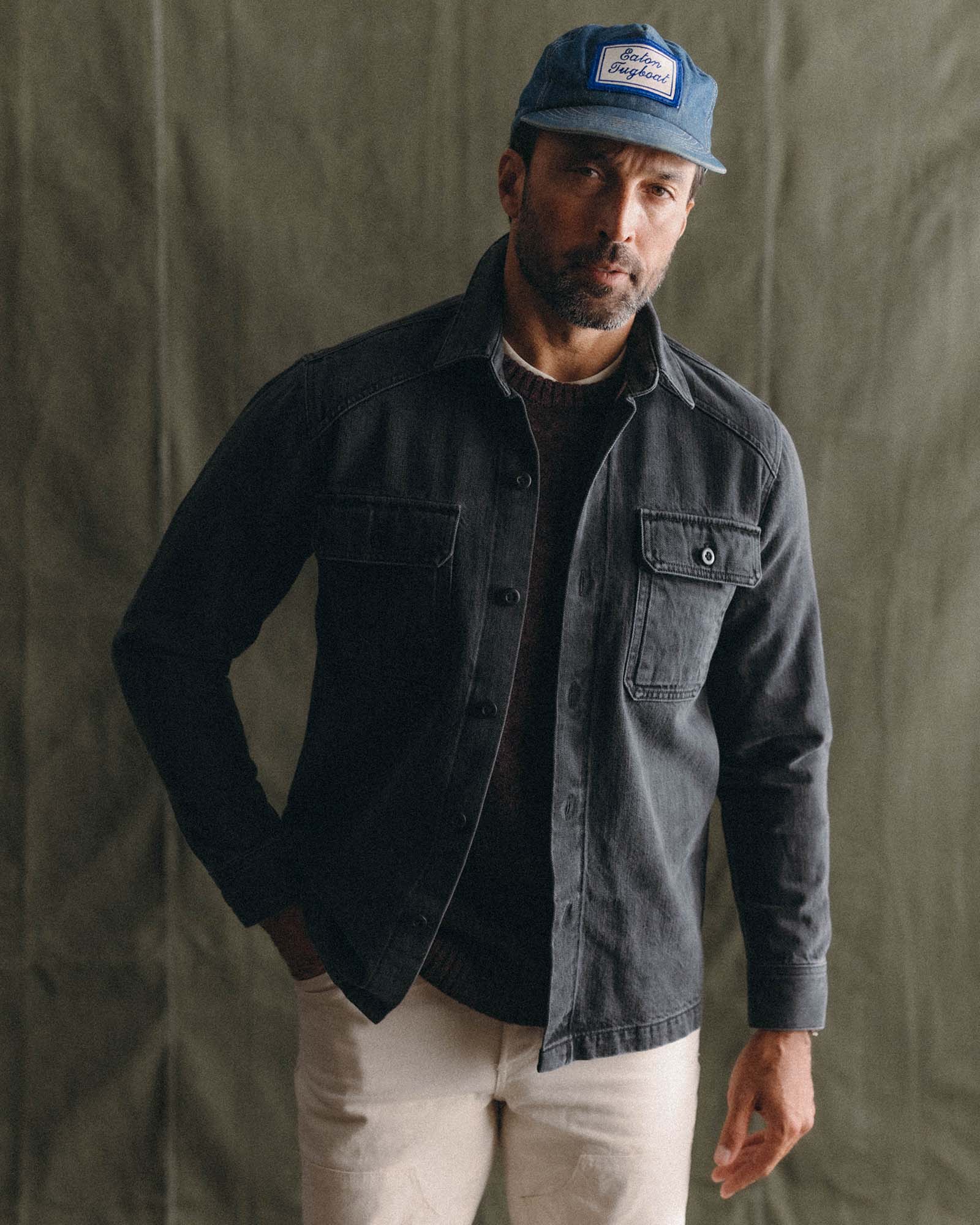 fit model posing in The Shop Shirt in Washed Black Organic Slub Selvedge, Wovens by Taylor Stitch