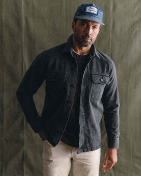 fit model posing in The Shop Shirt in Washed Black Organic Slub Selvedge, Wovens by Taylor Stitch