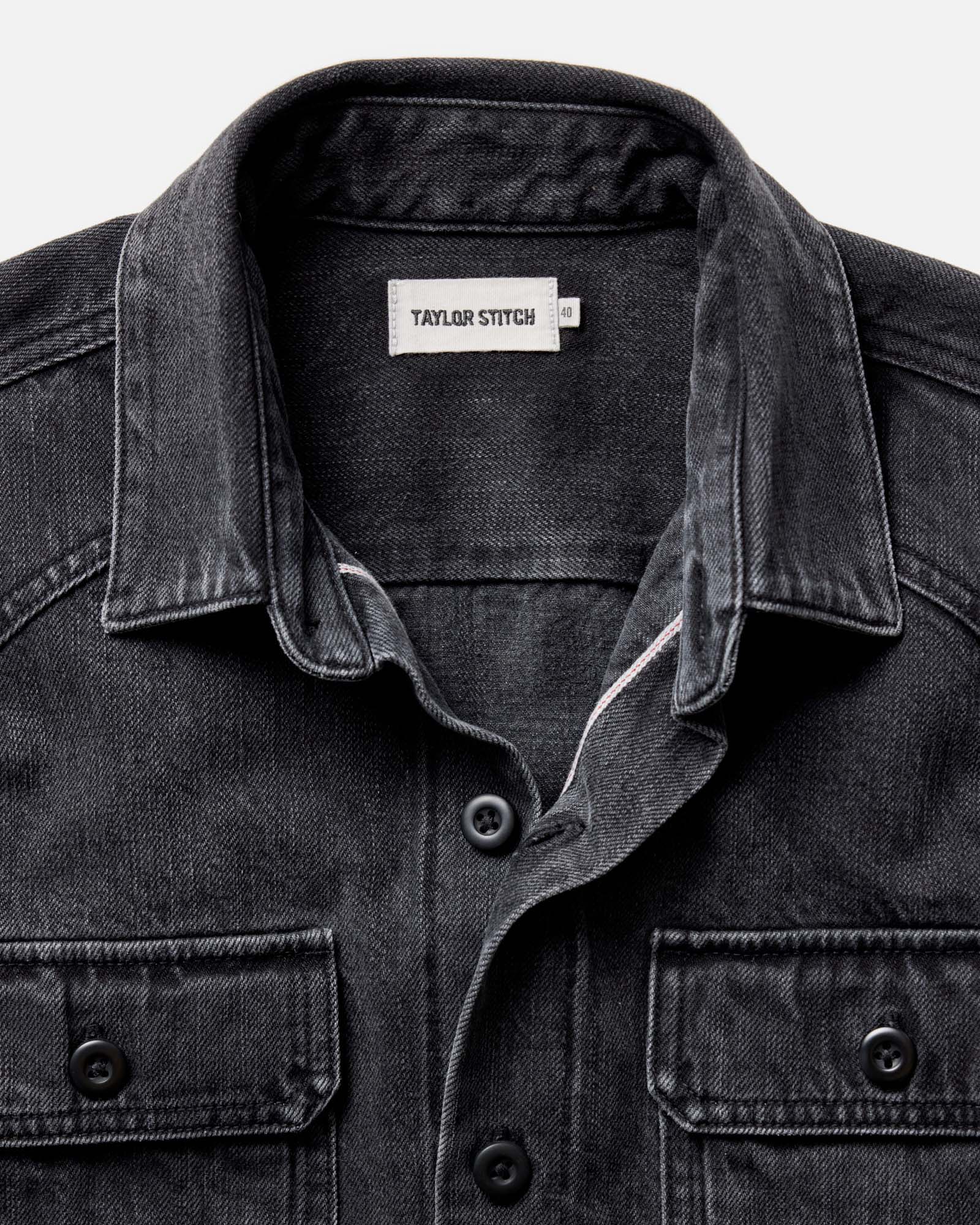 material shot of the collar on The Shop Shirt in Washed Black Organic Slub Selvedge, Wovens by Taylor Stitch