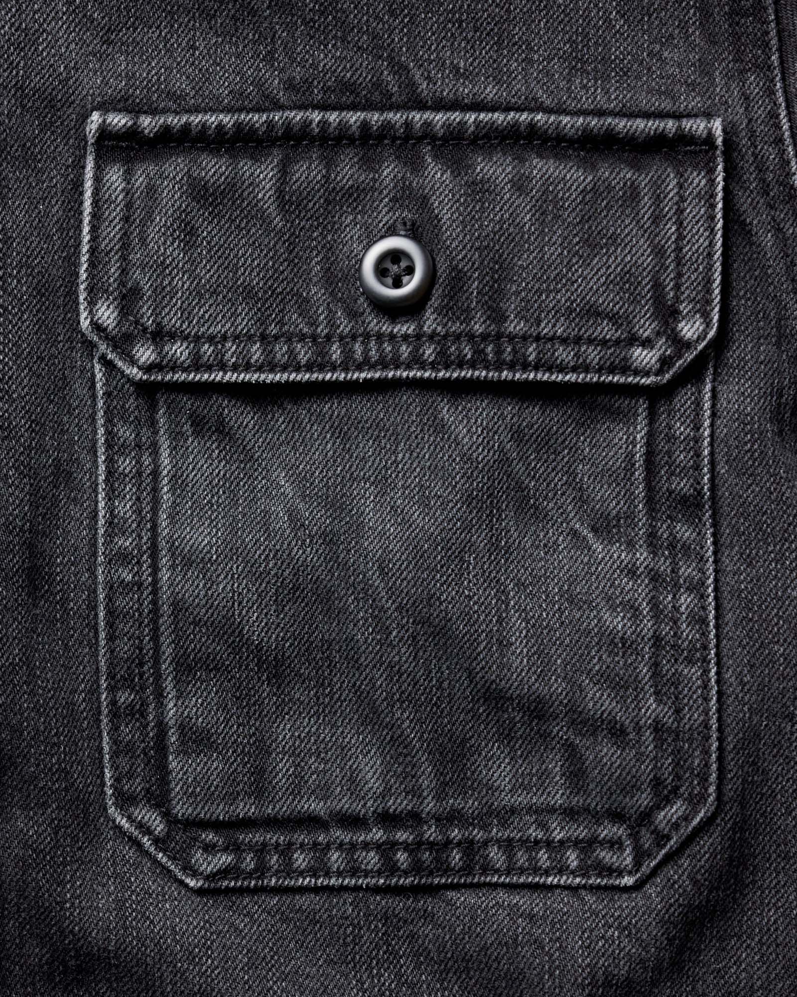 material shot of the pocket on The Shop Shirt in Washed Black Organic Slub Selvedge, Wovens by Taylor Stitch