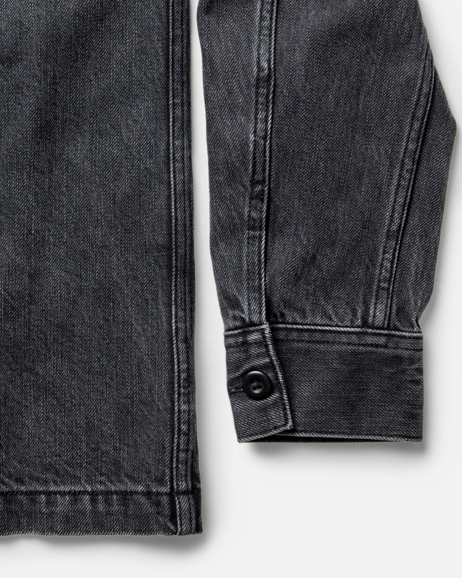 material shot of the sleeves on The Shop Shirt in Washed Black Organic Slub Selvedge, Wovens by Taylor Stitch