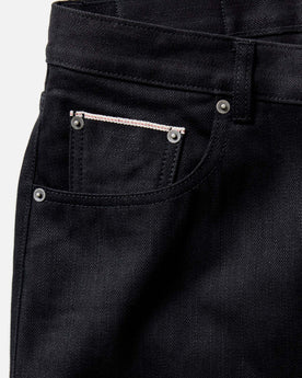 flatlay of The Slim Jean in Rigid Black Organic Selvedge, Bottoms by Taylor Stitch
