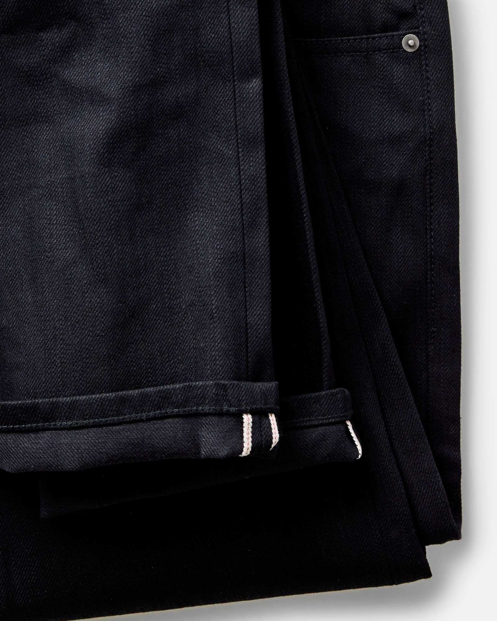 material shot of the waistband on The Slim Jean in Rigid Black Organic Selvedge, Bottoms by Taylor Stitch