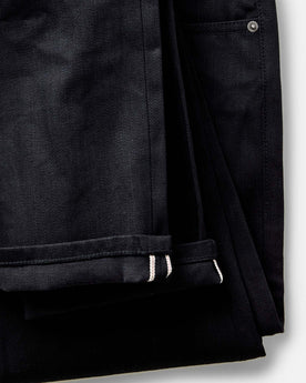 material shot of the waistband on The Slim Jean in Rigid Black Organic Selvedge, Bottoms by Taylor Stitch