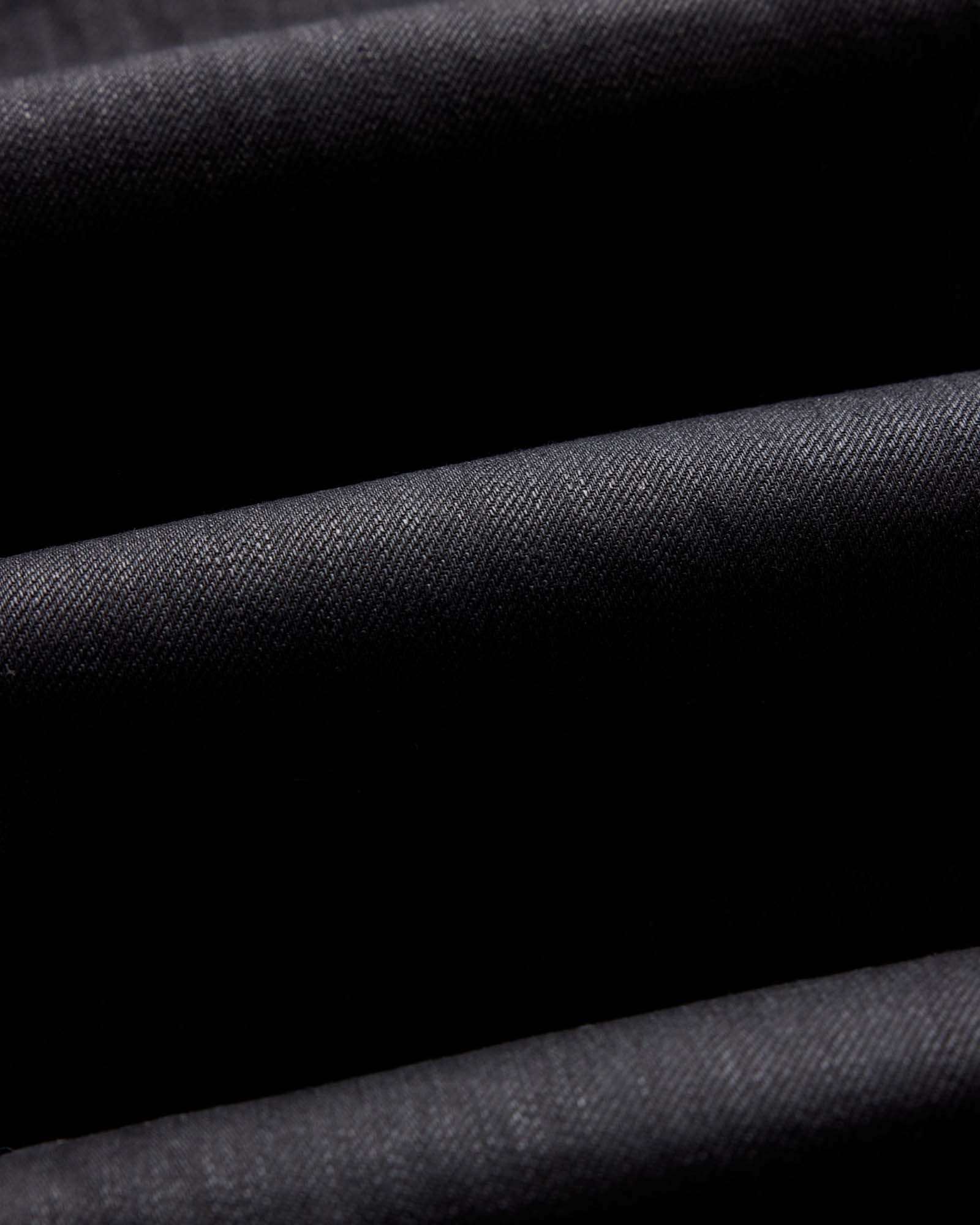 folded flatlay of the back of The Slim Jean in Rigid Black Organic Selvedge, Bottoms by Taylor Stitch