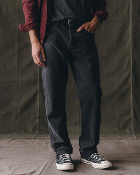 fit model posing in The Straight Jean in Washed Black Organic Slub Selvedge, Bottoms by Taylor Stitch