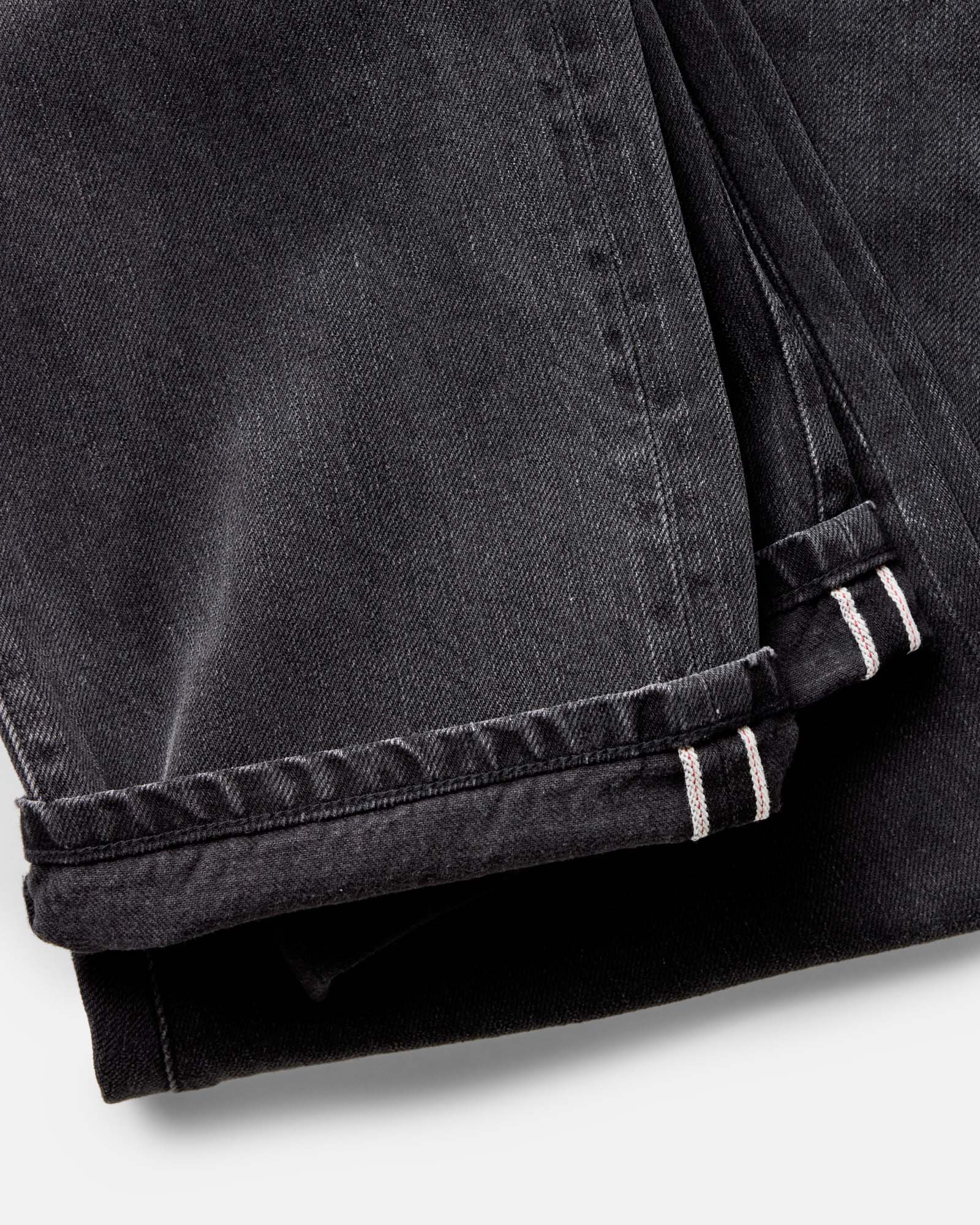 material shot of the cuffs on The Straight Jean in Washed Black Organic Slub Selvedge, Bottoms by Taylor Stitch