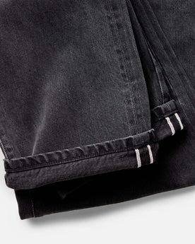 material shot of the cuffs on The Straight Jean in Washed Black Organic Slub Selvedge, Bottoms by Taylor Stitch