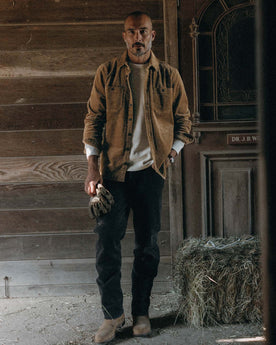 fit model posing in The Utility Shirt in Bourbon Corduroy, Wovens by Taylor Stitch