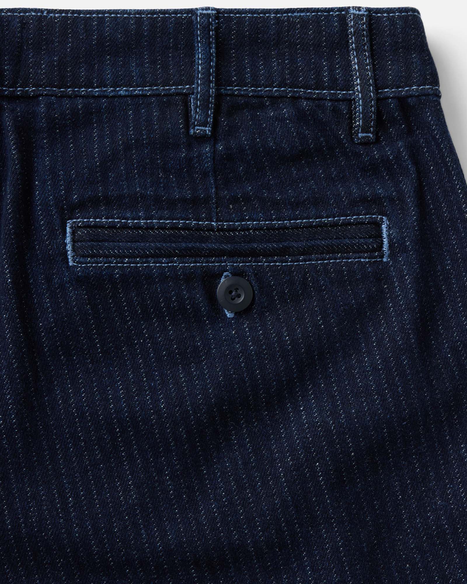 material shot of the back pocket on The Camden Pant in Rinsed Indigo Roped Denim, Bottoms by Taylor Stitch