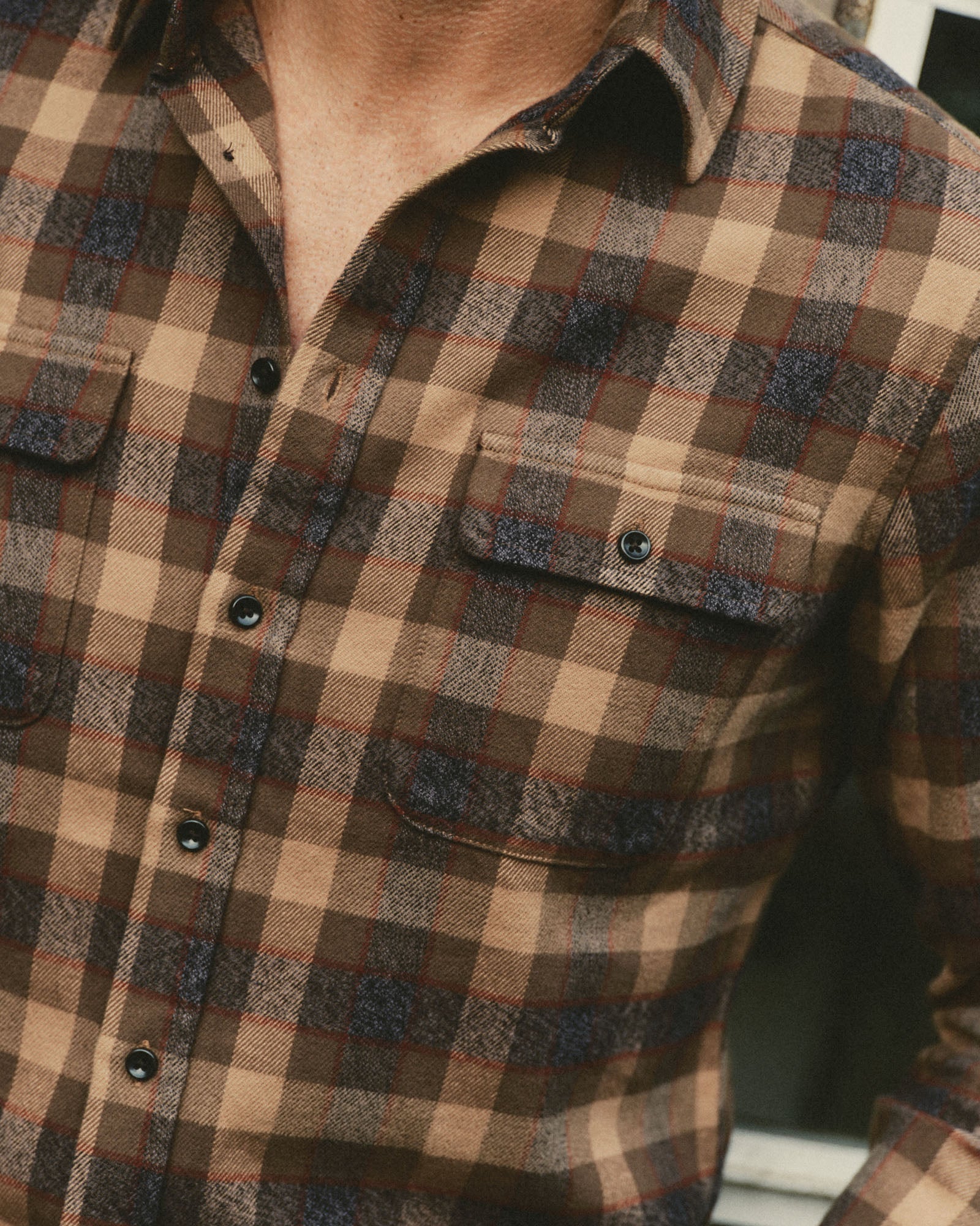 fit model showing off the pocket on The Yosemite Shirt in Buckeye Plaid, Wovens by Taylor Stitch