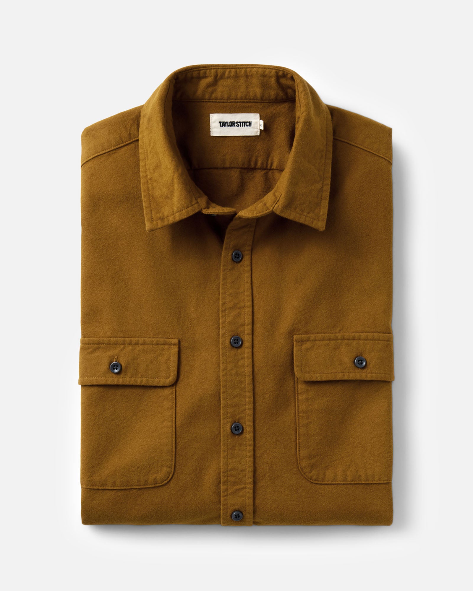 folded flatlay of The Yosemite Shirt in Saffron, Wovens by Taylor Stitch