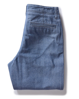 flatlay of The Morse Pant in Bleached Indigo Herringbone, folded from back, Bottoms by Taylor Stitch