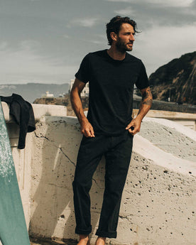 fit model showing off The Merino Tee in Heather Black, Knits by Taylor Stitch
