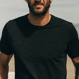 fit model showing off The Merino Tee in Heather Black