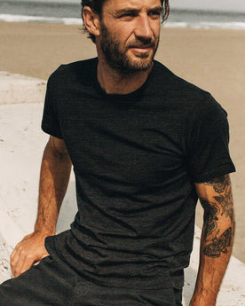 fit model showing off the shoulders on The Merino Tee in Heather Black, Knits by Taylor Stitch