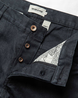 material shot of the button fly on The Chore Pant in Coal Boss Duck, Bottoms by Taylor Stitch