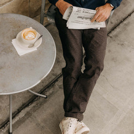 fit model showing the bottom of The Carnegie Pant in Peat Herringbone