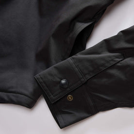 material shot of the snap cuffs on The Lined Maritime Shirt Jacket in Coal