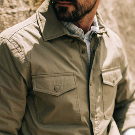 fit model showing the front snap pockets on The Lined Maritime Shirt Jacket in Olive